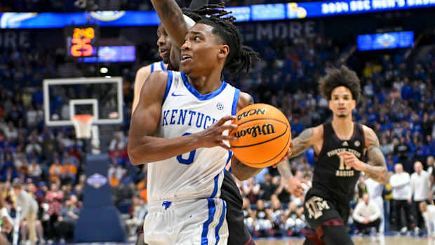Mar 15, 2024; Nashville, TN, USA; Kentucky Wildcats guard Rob Dillingham (0) drives past Texas A&M Aggies guard Manny Obaseki (35) during the second half at Bridgestone Arena. Mandatory Credit: Steve Roberts-USA TODAY Sports